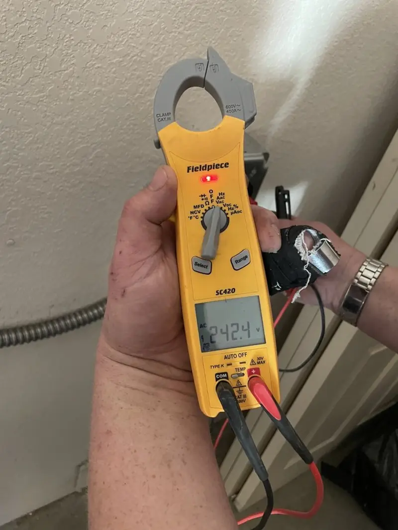 Voltage testing with clamp meter during Generator Installation in Dania Beach